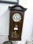 A MODERN MAHOGANY WELLINGTON WALL CLOCK, WITH SPRING DRIVEN AND CHIMING MOVEMENT