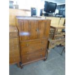 A GEORGE V MAHOGANY TALLBOY HAVING TWO CUPBOARD DOORS OVER THREE DRAWERS (A.F.)