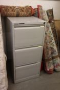 A BISLEY GREY METAL THREE DRAWER FILING CABINET