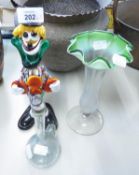 A COLOURED GLASS MODEL OF A CLOWN, COLOURED GLASS TRUMPET VASE AND A CRACKLED GLASS JUG (3)