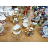 GERMAN GILT CHINA COFFEE SERVICE OF 15 PIECES, EACH PIECE PRINTED IN SMALL RESERVE WITH COURTIER AND