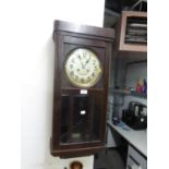 AN OAK WELLINGTON WALL CLOCK