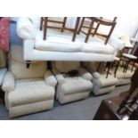 A LOUNGE SUITE COVERED IN LIGHT CREAM LEAF EMBOSSED FABRIC, VIZ A SETTEE IN THREE PARTS, THE TWO