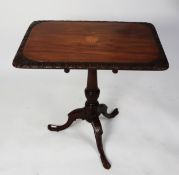 NINETEENTH CENTURY CONTINENTAL INLAID AND CARVED MAHOGANY TILT TOP OCCASIONAL TABLE, the rounded