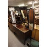 A MAHOGANY DRESSING TABLE WITH TWO SHORT AND ONE LONG DRAWER, THE THREE MIRRORS