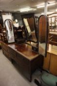 A MAHOGANY DRESSING TABLE WITH TWO SHORT AND ONE LONG DRAWER, THE THREE MIRRORS