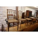 A SET OF THREE BAMBOO PATTERN BEDROOM SINGLE CHAIRS, WITH SPINDLE BACKS, CANE PANEL SEATS (3)