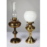 TWO BRASS OIL PATTERN TABLE LAMPS, one with orbicular white glass shade (base of the lamp