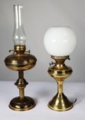 TWO BRASS OIL PATTERN TABLE LAMPS, one with orbicular white glass shade (base of the lamp