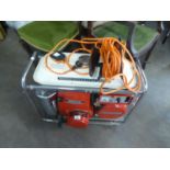 A HONDA PETROL RUN PORTABLE GENERATOR, MODEL E2500, WITH ELECTRIC CABLE AND MANUAL