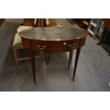 A MAHOGANY OVAL WRITING TABLE WITH INLET LEATHER TOP, FRIEZE DRAWER, ON FOUR SQUARE TAPERING LEGS