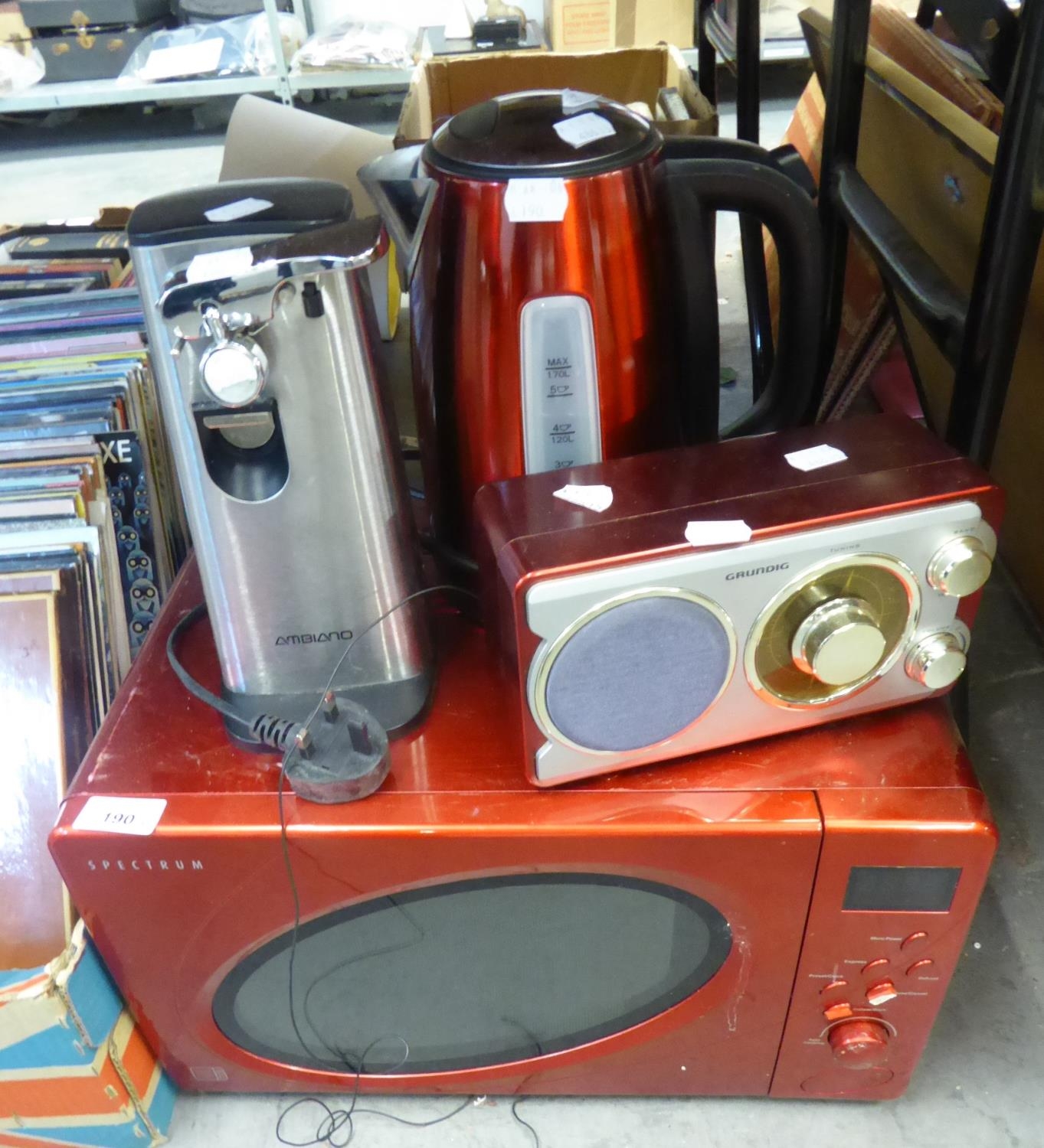 SPECTRUM RED CASE MICROWAVE OVEN; AN ELECTRIC CAN OPENER;KETTLE AND A GRUNDIG RADIO