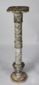 TWENTIETH CENTURY CARVED GREY VEINED MARBLE PEDESTAL, of wrythen fluted form with octagonal foot and