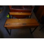 A VINTAGE CHILD'S DOUBLE SEATER OAK DESK, HAVING TWO SLIDE TOP INKWELLS, LIFT-UP DESK TOP AND A