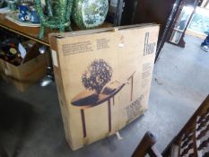 A LARGE GREEN PLASTIC GARDEN TABLE (BOXED)