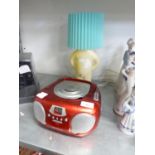 GROOVE’ PORTABLE RADIO/CD PLAYER AND A POTTERY FIGURE TABLE LAMP
