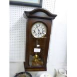 A MODERN MAHOGANY WELLINGTON WALL CLOCK, WITH SPRING DRIVEN AND CHIMING MOVEMENT