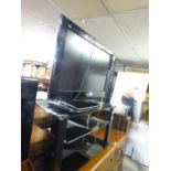 PANASONIC FLAT SCREEN TELEVISION, THE BLACK GLASS STAND AND ACCESSORIES