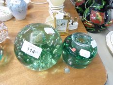 NINETEENTH CENTURY GREEN BUBBLE GLASS DUMP DOOR STOP AND A CLEAR GREEN GLASS OLD INKWELL (2)