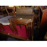 A NEST OF THREE MAHOGANY COFFEE TABLES WITH GLASS TOP PROTECTORS ON CABRIOLE LEGS