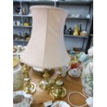A PAIR OF BRASS CANDLESTICK PATTERN TABLE LAMPS AND SHADES AND A LARGER BRASS LAMP AND SHADE (3)