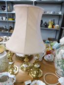 A PAIR OF BRASS CANDLESTICK PATTERN TABLE LAMPS AND SHADES AND A LARGER BRASS LAMP AND SHADE (3)