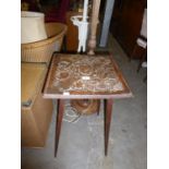 A CARVED TOP OCCASIONAL TABLE