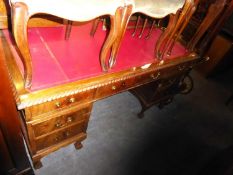 A TWIN PEDESTAL LARGE DESK WITH RED LEATHER INSET TOP