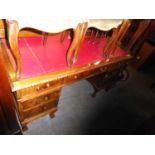 A TWIN PEDESTAL LARGE DESK WITH RED LEATHER INSET TOP