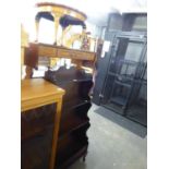 AN OAK FOUR TIER ‘WATERFALL’ OPEN BOOKCASE, WITH DRAWER IN THE BASE AND A CIRCULAR COFFEE TABLE,