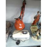 AN ORANGE METAL ANGLEPOISE LAMP AND A PORTABLE RADIO (2)