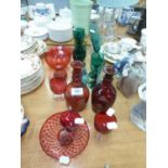 A SELECTION OF COLOURED GLASSWARE TO INCLUDE; TWO SMALL RUBY GLASS DECANTERS, 8 OTHER ITEMS OF