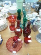A SELECTION OF COLOURED GLASSWARE TO INCLUDE; TWO SMALL RUBY GLASS DECANTERS, 8 OTHER ITEMS OF