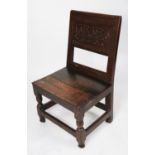 ANTIQUE CARVED OAK SIDE CHAIR, with scroll carved panel to the back, solid seat and block and turned