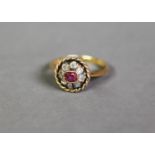 ANTIQUE GOLD, RUBY AND DIAMOND RING with centre oblong collet set ruby and surround of eight small