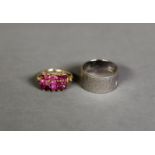 VICTORIAN GOLD RING SET WITH THREE ROWS EACH OF FIVE RUBIES WITH OPEN SCROLLWORK SHOULDERS, the