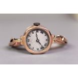 LADY'S 9ct GOLD CASED WRISTWATCH with Swiss movement, circular silvered roman dial and gold plated