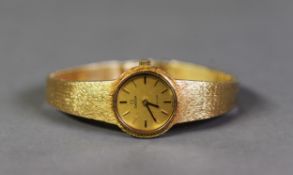 LADY'S OMEGA DE VILLE 18ct GOLD BRACELET WATCH, with mechanical movement, in case, 39gms (c/r in