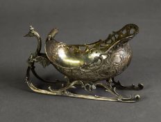 AN 800 GRADE NOVELTY SILVER BON-BON DISH, in the form of a sleigh or sled, lacking reindeer team,