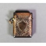 EDWARDIAN 9ct GOLD VESTA BOX, rectangular with all-over engraved decoration save for a vacant shield