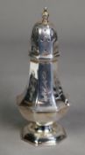 LATE VICTORIAN ENGRAVED SILVER PEDESTAL PEPPERETTE, of panelled form, decorated with foliate
