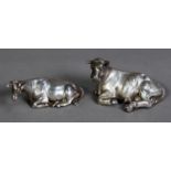 TWO FILLED SILVER MODELS OF RECUMBENT COWS, the smaller by Henry Wilkinson & Co, Sheffield 1840,