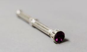 VICTORIAN ENGRAVED SILVER CASED RETRACTABLE PENCIL, the top set with amethyst coloured glass,
