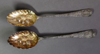 GEORGE III MATCHED PAIR OF EMBOSSED SILVER BERRY SPOONS, of typical form with gilt bowls and
