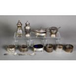 SET OF THREE SILVER CONDIMENTS viz PEPPERETTE, MUSTARD POT AND SPOON with blue glass liner, SALT