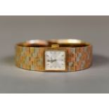 LADY'S BUECHE GIROD TWO-COLOUR BARK TEXTURED 9ct GOLD BRACELET WATCH, with mechanical movement,