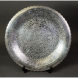 EGYPTIAN ENGRAVED SILVER COLOURED METAL TRAY, of circular form with petal shaped border, profusely