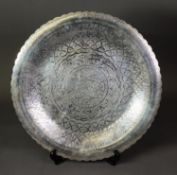 EGYPTIAN ENGRAVED SILVER COLOURED METAL TRAY, of circular form with petal shaped border, profusely