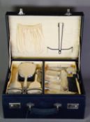 GEORGE V LADY’S TRAVEL CASE FITTED WITH SIX PIECE ENGINE TURNED SILVER BACKED HAND MIRROR AND