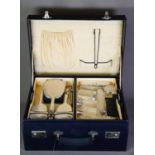 GEORGE V LADY’S TRAVEL CASE FITTED WITH SIX PIECE ENGINE TURNED SILVER BACKED HAND MIRROR AND